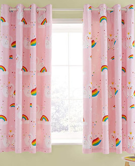 Pale pink and white speckled curtains with a white unicorn pattern.