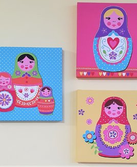 3 x bright canvas. They each have a bright background with a doll in the centre