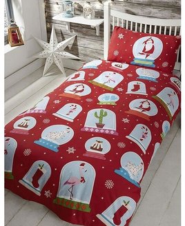 Red Christmas Bedding, patterned with snowflakes and christmassy snow globes.
