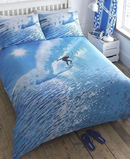 Brilliant Blue Ocean Bedding with a Lone Surfer riding the waves. Photographic Quality Bedding