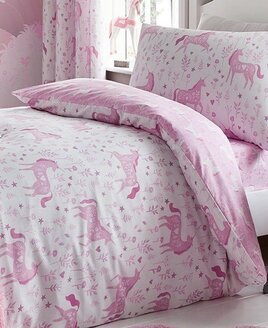 Reversible two tone pink toddler bed set with a floral pattern and heart adorned unicorns.
