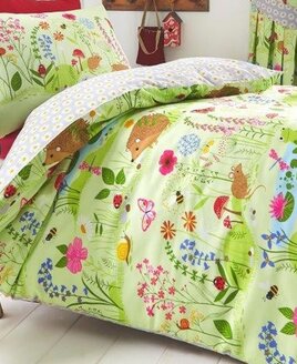 Bluebell Woods, Toddler Bed Set. Green Forest filled with Woodland Animals. Reverse has a grey and white daisy print.