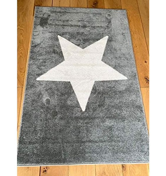 Grey rug with a large white star placed in the centre.