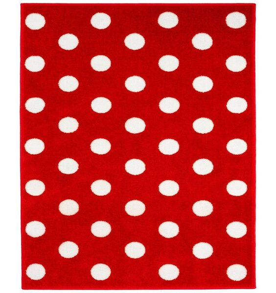 Red, rectangular rug patterned with large white spots.