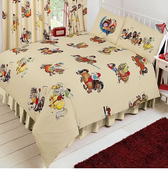 Cream duvet covers patterend with Thelwell, Cartoon Ponies and Riders.