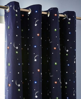 Pair of dark blue, eyelet curtains, patterned with stars and shooting stars