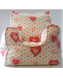 Small, White Bean Filled Armchair For A Little Girl. Pink Piping to the Seams and Patterned With Pink and Blue Lovehearts.