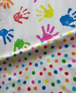 White Toddler Bed Set Patterned With Colourful Toddler Hand Prints With a Reverse Of Messy Dots