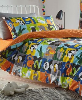 reversible duvet cover. Colourful, cute animal filled squares, with a spotted burnt orange reverse.