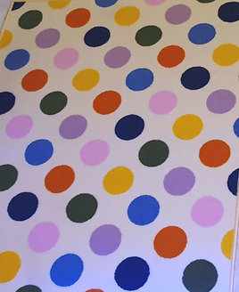 Large, rectangular off white rug patterned with large multicoloured spots - blue, pink, orange, yellow, lilac, green and red