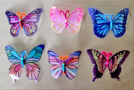 Butterfly window decorations made from plastic milk cartons